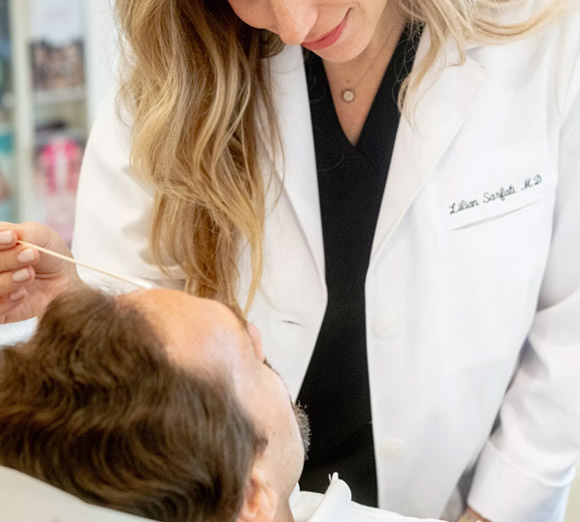 skincare professional giving client a skincare treatment